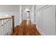 A hallway with white trim, wood floors, paneled walls, and access to other rooms at 686 Amsterdam Ne Ave, Atlanta, GA 30306