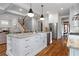 Spacious kitchen island with granite countertops, white cabinets, and stainless steel appliances at 686 Amsterdam Ne Ave, Atlanta, GA 30306