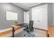 Office with desk, gray walls, storage cabinet, and white trim at 686 Amsterdam Ne Ave, Atlanta, GA 30306