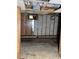 Partially renovated basement with wood paneling, exposed cinder block, and ceiling at 1405 Mote Rd, Covington, GA 30016