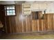 Bedroom with wood paneling, window and peeling ceiling at 1405 Mote Rd, Covington, GA 30016