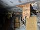 Interior home damage with charred ceiling, damaged wall, and exposed window at 1405 Mote Rd, Covington, GA 30016