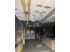 Damaged kitchen featuring charred cabinets, ceiling, and walls after a fire at 1405 Mote Rd, Covington, GA 30016