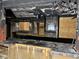 Extensive kitchen damage with charred counters, blackened walls, and missing drywall at 1405 Mote Rd, Covington, GA 30016