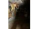 Severely damaged room featuring charred walls, burned ceiling, boarded window, and debris at 1405 Mote Rd, Covington, GA 30016