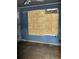 Damaged room featuring boarded window and water stains on the walls at 1405 Mote Rd, Covington, GA 30016