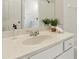 This bathroom features a well-lit vanity with gold faucets and fixtures, and white cabinets at 1815 Montcliff Dr, Cumming, GA 30041