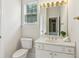 This bathroom features a well-lit vanity with gold accents, providing a clean and inviting space at 1815 Montcliff Dr, Cumming, GA 30041