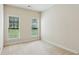 Bright bedroom with two windows and plush carpeting, offering a comfortable and inviting space at 1815 Montcliff Dr, Cumming, GA 30041