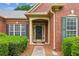 Inviting front entrance with green shutters and well-maintained landscaping at 1815 Montcliff Dr, Cumming, GA 30041