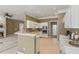 Bright kitchen with white cabinets, stainless appliances, and adjacent dining area at 1815 Montcliff Dr, Cumming, GA 30041