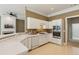 Well-lit kitchen offers white cabinets, stainless steel appliances, and neutral countertops at 1815 Montcliff Dr, Cumming, GA 30041