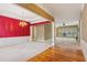 Open-concept living space with elegant chandelier, carpet flooring, and stylish accents at 1815 Montcliff Dr, Cumming, GA 30041