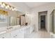 The main bathroom features double sinks, a bathtub, and a separate glass-enclosed shower at 1815 Montcliff Dr, Cumming, GA 30041