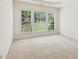 Bright main bedroom with large windows offering backyard views and filling the room with natural light at 1815 Montcliff Dr, Cumming, GA 30041