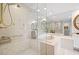 Bathroom showcasing a glass-enclosed shower and a soaking tub at 2660 Peachtree Rd # 7F, Atlanta, GA 30305