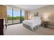 Bedroom with neutral decor, balcony access, and elegant furnishings at 2660 Peachtree Rd # 7F, Atlanta, GA 30305