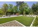 Well maintained common area with lush landscaping, seating, and a pergola at 2660 Peachtree Rd # 7F, Atlanta, GA 30305