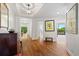 Elegant foyer with hardwood floors, decorative lighting, and framed artwork, offering a warm welcome at 2660 Peachtree Rd # 7F, Atlanta, GA 30305