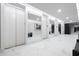 Hallway with white marble floors, three elevators, large mirrors and modern design at 2660 Peachtree Rd # 7F, Atlanta, GA 30305