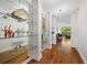 Hallway featuring hardwood floors, shelving, and an open view to the living area at 2660 Peachtree Rd # 7F, Atlanta, GA 30305
