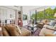 Comfortable living room with built-in shelving, french doors, and large windows with neighborhood views at 2660 Peachtree Rd # 7F, Atlanta, GA 30305