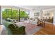Bright living room with hardwood floors, neutral furniture, large windows and views to the balcony at 2660 Peachtree Rd # 7F, Atlanta, GA 30305