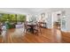 Spacious living area with hardwood floors, dining table, and large windows offering natural light and city views at 2660 Peachtree Rd # 7F, Atlanta, GA 30305