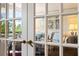 Living room view through french doors with mirrored windows showcasing elegant and comfortable living space at 2660 Peachtree Rd # 7F, Atlanta, GA 30305