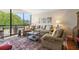 Bright living room featuring neutral tones, comfortable seating, and a large window with scenic views at 2660 Peachtree Rd # 7F, Atlanta, GA 30305