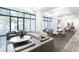 Bright lounge area featuring stylish seating, modern lighting fixtures, and large windows at 2660 Peachtree Rd # 7F, Atlanta, GA 30305