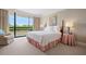Bedroom with balcony, white linens, side tables, and calm colors creating a relaxing atmosphere at 2660 Peachtree Rd # 7F, Atlanta, GA 30305