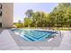 Outdoor swimming pool with surrounding lounge area, offering a relaxing oasis at 2660 Peachtree Rd # 7F, Atlanta, GA 30305