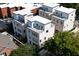 Aerial view showcases the unique cluster of modern townhomes, each with rooftop terraces and private outdoor spaces at 420-D Parkway Ne Dr, Atlanta, GA 30308