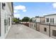 Spacious balcony with metal railing overlooking neighboring townhomes at 420-D Parkway Ne Dr, Atlanta, GA 30308