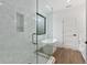 Bright bathroom with a glass-enclosed shower, soaking tub, and modern fixtures at 420-D Parkway Ne Dr, Atlanta, GA 30308