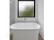 Close up of luxurious standalone tub and glass enclosed shower at 420-D Parkway Ne Dr, Atlanta, GA 30308