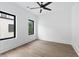 Bright bedroom featuring hardwood floors, lots of natural light, and a modern ceiling fan at 420-D Parkway Ne Dr, Atlanta, GA 30308