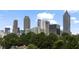 A picturesque view of the skyline from a distance, with lush trees in the foreground at 420-D Parkway Ne Dr, Atlanta, GA 30308