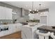 Bright kitchen with white cabinets, stainless steel appliances, and a large island at 420-D Parkway Ne Dr, Atlanta, GA 30308
