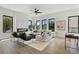 Bright living room with fireplace, modern furniture, hardwood floors, and three large windows at 420-D Parkway Ne Dr, Atlanta, GA 30308