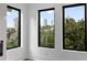 Bright living room featuring three windows with skyline views at 420-D Parkway Ne Dr, Atlanta, GA 30308