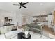 Bright, open-concept living room and kitchen featuring modern finishes, a ceiling fan, and hardwood floors at 420-D Parkway Ne Dr, Atlanta, GA 30308