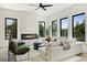 Well-lit living room with a modern fireplace, contemporary furniture, hardwood floors and large windows at 420-D Parkway Ne Dr, Atlanta, GA 30308