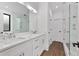Modern main bathroom featuring dual vanities with a glass-enclosed walk-in shower at 420-D Parkway Ne Dr, Atlanta, GA 30308