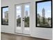 Windows and doors showcase a stunning city skyline and trees at 420-D Parkway Ne Dr, Atlanta, GA 30308
