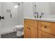Modern bathroom featuring a glass shower, stylish vanity, and hexagon tile flooring at 50 Maple St, Roswell, GA 30075