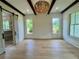 A spacious bedroom featuring natural light, wood beams, and an ensuite bathroom with a sliding barn door at 50 Maple St, Roswell, GA 30075