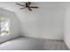 Bright bedroom featuring carpet, large window, ceiling fan, and recessed lighting for a comfortable and inviting space at 50 Maple St, Roswell, GA 30075