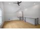Spacious bonus room with high ceilings, hardwood floors, modern railing and abundant natural light at 50 Maple St, Roswell, GA 30075